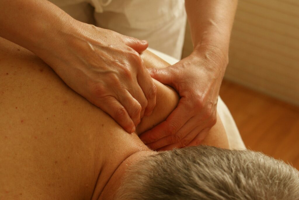 pexels-photo-275768-275768 Close-up of a therapist giving a relaxing shoulder massage, enhancing wellness and stress relief.