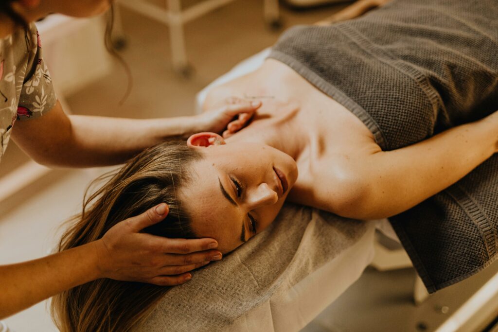 pexels-photo-6629551-6629551 A woman enjoying a relaxing spa massage indoors. Perfect depiction of therapy and self-care.