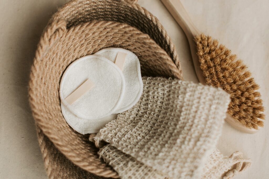 pexels-photo-6634678-6634678 A top view of eco-friendly skincare items like cotton pads and brush in a jute basket. Sustainable lifestyle.